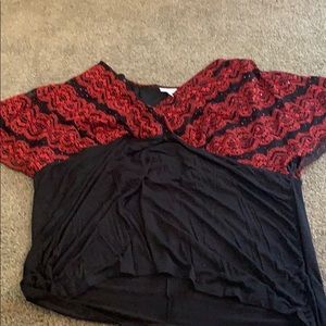 A black blouse and red sequin upper area